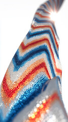 Colorful textured fabric with zigzag pattern and light reflection