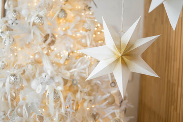 Beautiful Christmas tree in decorated living room. Festive interior
