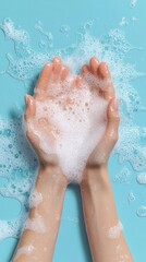 Fototapeta premium Hands with soapy foam under running water, the washing process — blogs about hygiene, skin care, advertising soap and cosmetics.