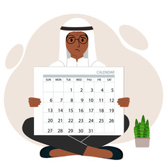 A man sits cross-legged and holds a large calendar glider in his hands. Concept of planning, make plans, schedule, event.