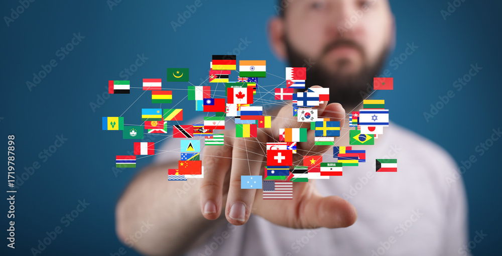 Aufkleber man interacts with a network of world flags, symbolizing global connection and international busines