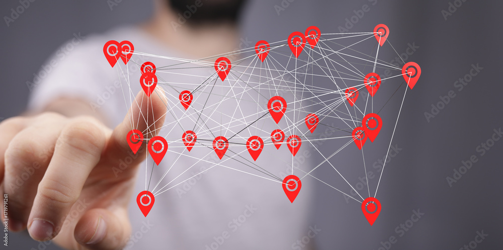 Poster hand interacting with a digital network map of interconnected location points. concept of global con