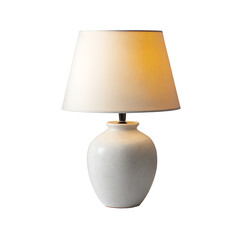 Elegant table lamp with a crackled ceramic base and a fabric lampshade illuminating a warm glow in a dark room adding a touch of sophistication