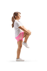 Full length profile shot of a girl stretching knee
