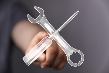 Close-up of a hand interacting with digital tools, representing repair, maintenance, or technology solutions.