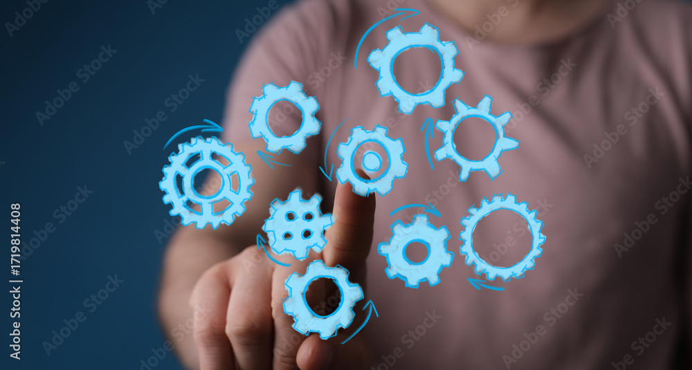 Aufkleber image of hand interacting with digital gears, perfect for process, teamwork, and workflow concepts. 