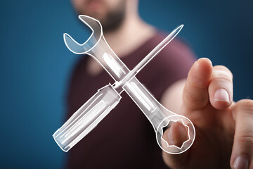 Image of a hand interacting with a digital drawing of a wrench and screwdriver, symbolizing repair,...