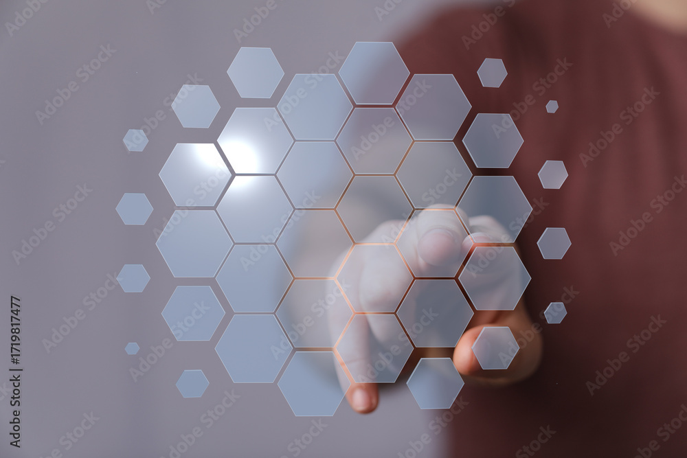 Poster abstract image of hand interacting with a futuristic hexagon interface. perfect for technology, inno
