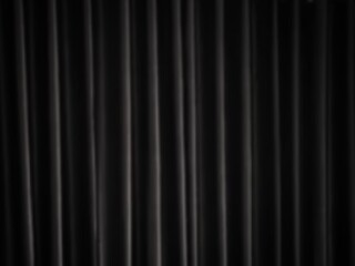 Black silk fabric background.Vertical draped satin cloth texture curtain.Smooth shiny drape material curtain. Realistic modern banner.