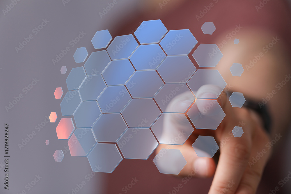 Poster abstract image of hand interacting with a digital hexagon network. ideal for tech, innovation, conne