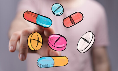 Image of hand interacting with colorful pills, representing healthcare, medicine, and treatment.