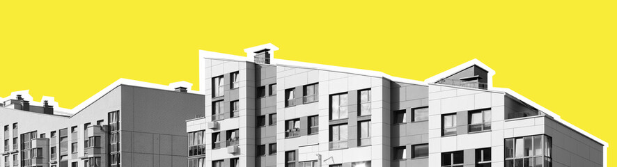 Modern residential building in minimalist style with geometric roof lines, black and white facade,
