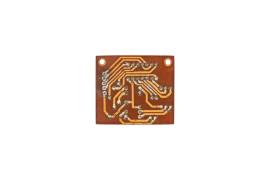 Old small electronic circuit board with copper tracks is isolated.