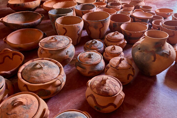 Still warm from the fire, the freshly fired pottery of Huancas emerges from the kiln — glowing with earthy tones, strength, and the mark of ancestral tradition