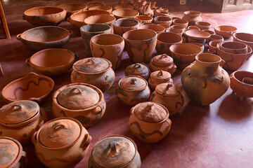Still warm from the fire, the freshly fired pottery of Huancas emerges from the kiln — glowing with earthy tones, strength, and the mark of ancestral tradition