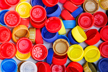 Multicolored bottle caps close-up for recycling concept. Recycling background made of plastic caps.