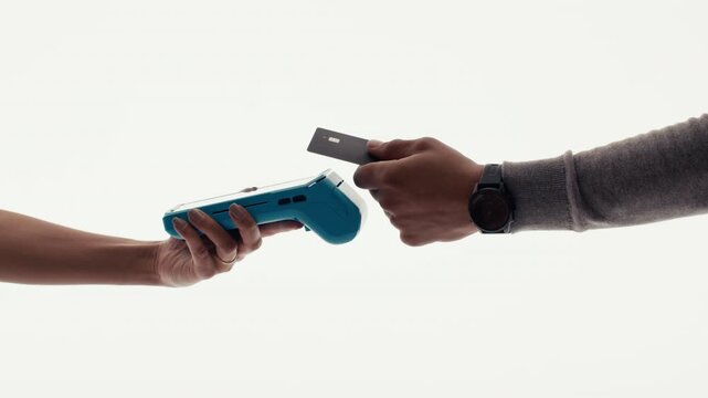 Contactless payment being made with a credit card on a blue terminal