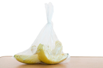 Bunch of bananas in plastic bag.