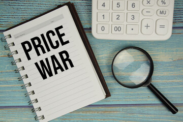 Price War text on notepad with magnifying glass and calculator on wooden background