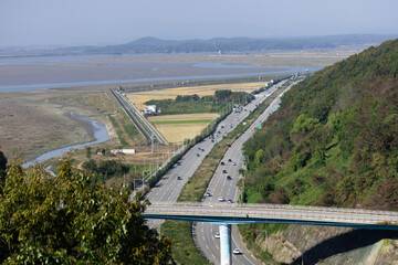 Aerial view of highway along the river separating South and North Korea at DMZ