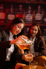 Closeup business woman holding a glass of whiskey