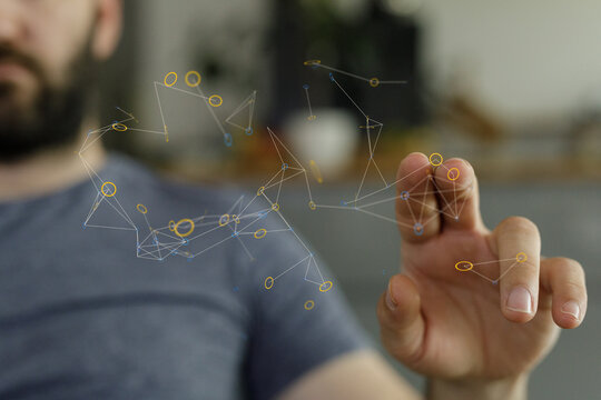 Close-up of a man's hand reaching out, slightly blurred background. Ideal for technology, connection, or interaction concepts.