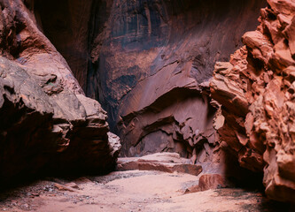 An Enclosed Passageway in a Canyon with Vibrant Colors and Geometric Shapes