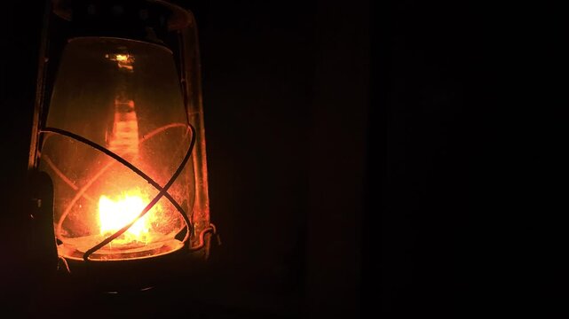 Glowing Lantern in Darkness