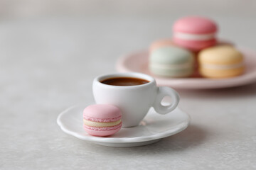 closeup of single coffee drop captured in pristine white cup surrounded by colorful accessories