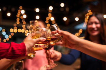 man and woman toasting with champagne at night