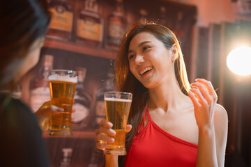 Friends having fun clinking glasses with beer