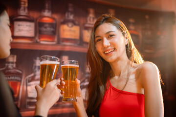  Friends having fun clinking glasses with beer