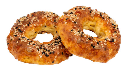 A donut with sesame seeds and sunflower seeds on a white background. Top view. Bun isolate.