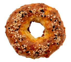 A donut with sesame seeds and sunflower seeds on a white background. Top view. Bun isolate.