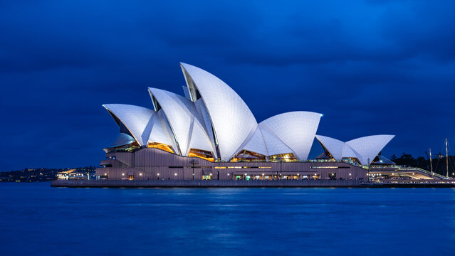 Sydney, New South Wales, Australia; February 24, 2024: The illuminated Sydney Opera House during the blue hour
