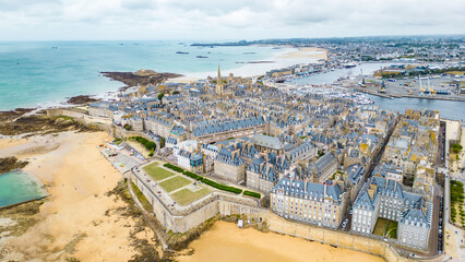 Aerial view of Saint-Malo, Brittany, France. Historic walled city on the English Channel with sandy...