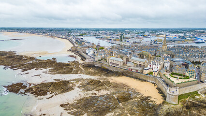 Aerial view of Saint-Malo, Brittany, France. Historic walled city on the English Channel with sandy beaches, stone fortifications, and a charming old town