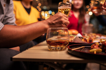 Celebrate whisky at an intimate party at a camping restaurant. group celebration.	