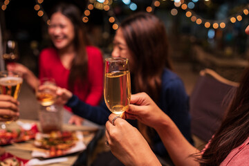 young couple celebrating with champagne at night