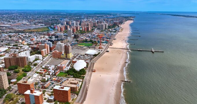 Descend over the wide sandy beach in Coney Island, New York, USA. Residential area and amusement park in the borough of Brooklyn.