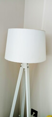 beautiful lamp with wood tripod decoration in a room
