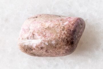 Obraz premium sample of tumbled pyroxmangite mineral on white
