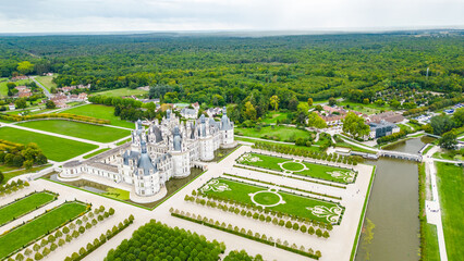 Aerial view of Ch&acirc;teau de Chambord, the largest and most majestic castle of the Loire Valley in France. Renaissance masterpiece with distinctive towers and intricate roofline, surrounded by vast park