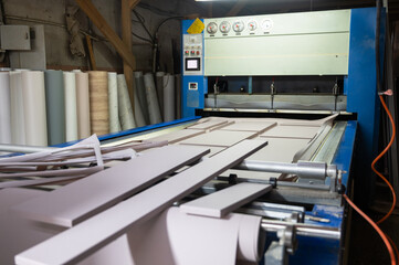 Grinding of wooden furniture panels on a machine. Furniture production concept