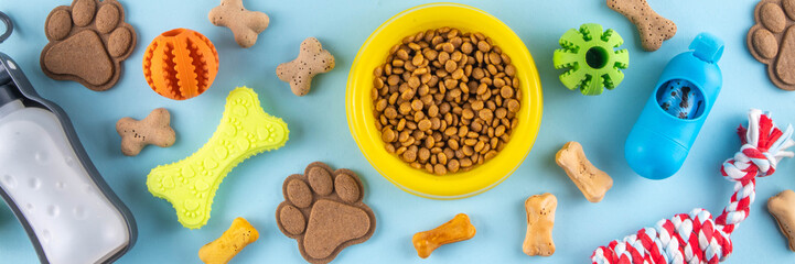 Flat lay composition with food, snacks, toys and accessories for dog and cat on bright background....
