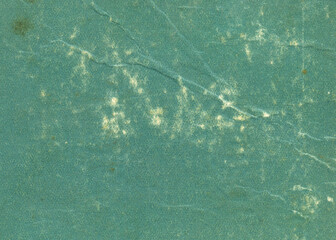 Green grunge scratched paper background. Texture of vintage book cover. 