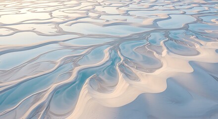 Aerial view of intricate sand patterns in a shallow water landscape