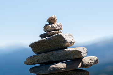 Meditative stack of stones in the stillness of the mountains. Balanced stack of stones