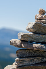 Meditative stack of stones in the stillness of the mountains. Balanced stack of stones