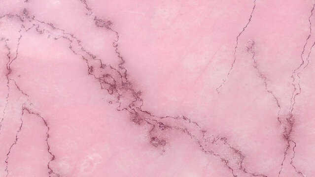 Luxurious light pink marble texture background displaying elegant veins suitable for a variety of creative designs and visual concepts